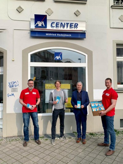 AXA Versicherung Center Chef Wilfried Rodenbeck mit dem WUM Vorstand Detlef Klotzsch, Tom Hagendorf und Andreas Rasehorn